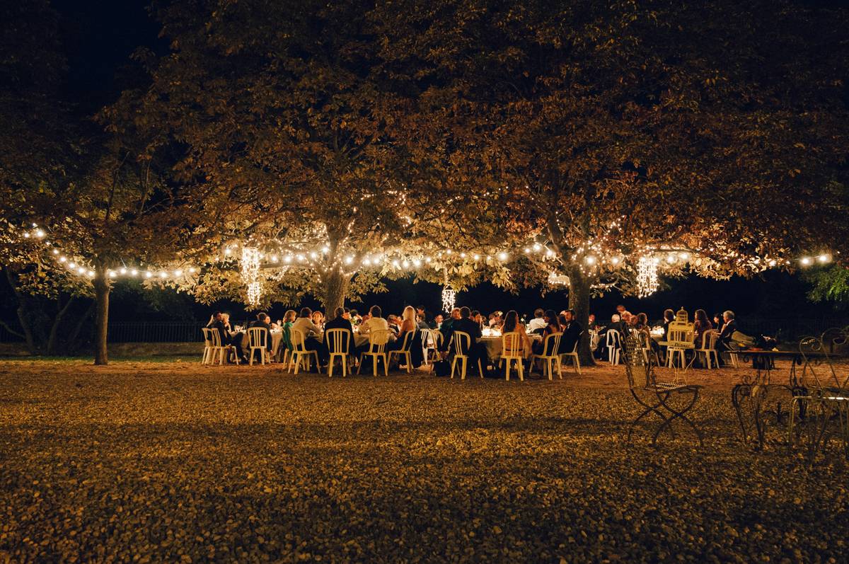 String lights, fairy lights, and LED lanterns arranged across a patio railing—lights for party decorations